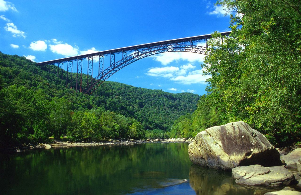 An engineering feat and regional icon, the New River Gorge Bridge connects the flourishing, green east and west banks of the river between two previously isolated communities.