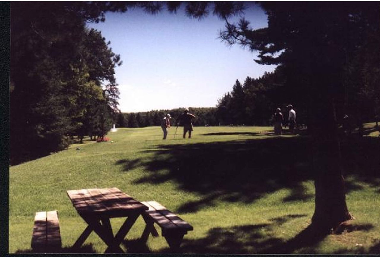 Two golfers set up a shot on one of the many courses along the Paul Bunyan Scenic Byway.