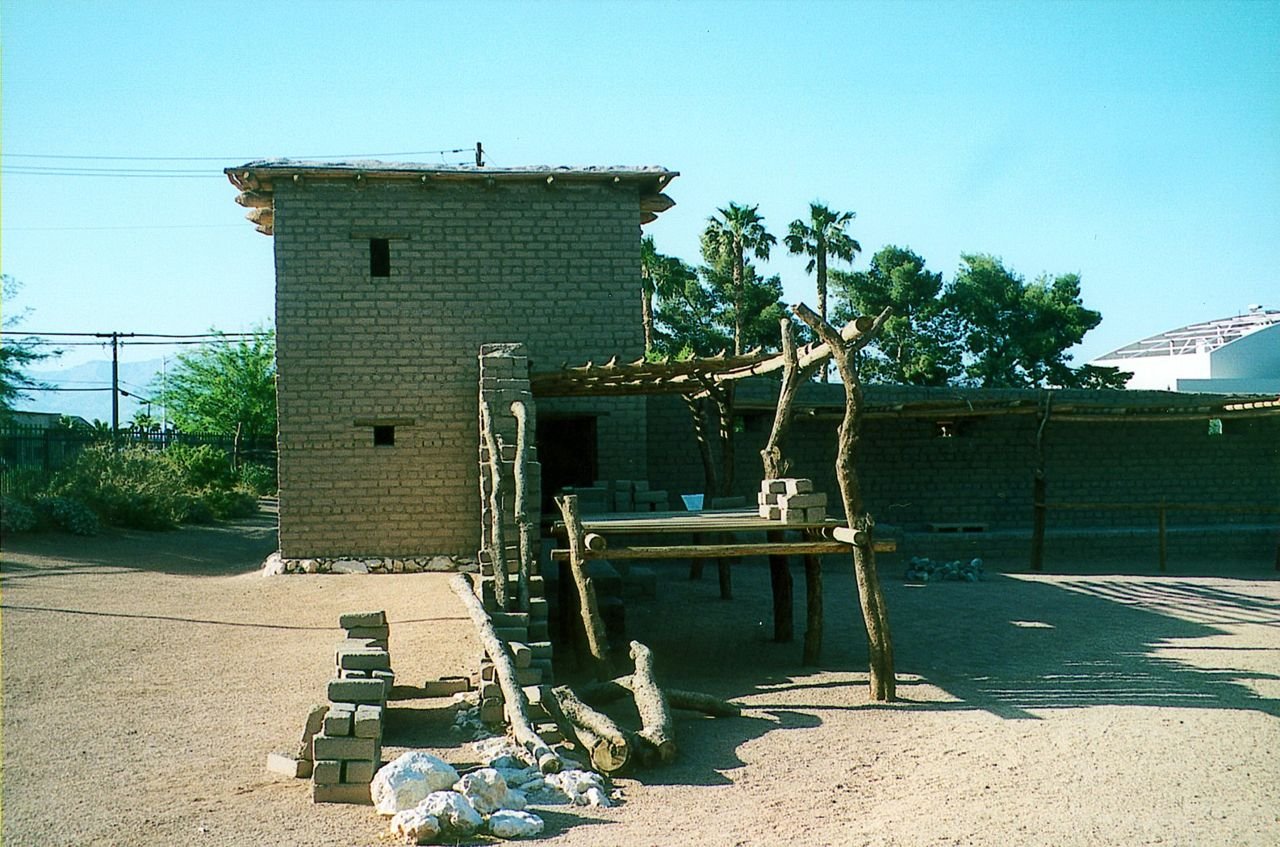 A bright blue sky overlooks the palm trees in the distance at the site of Mormon Fort.  This is a re-created section of the 1850s original settlement that would later become the Las Vegas townsite. The Fort is now a State of Nevada Park.