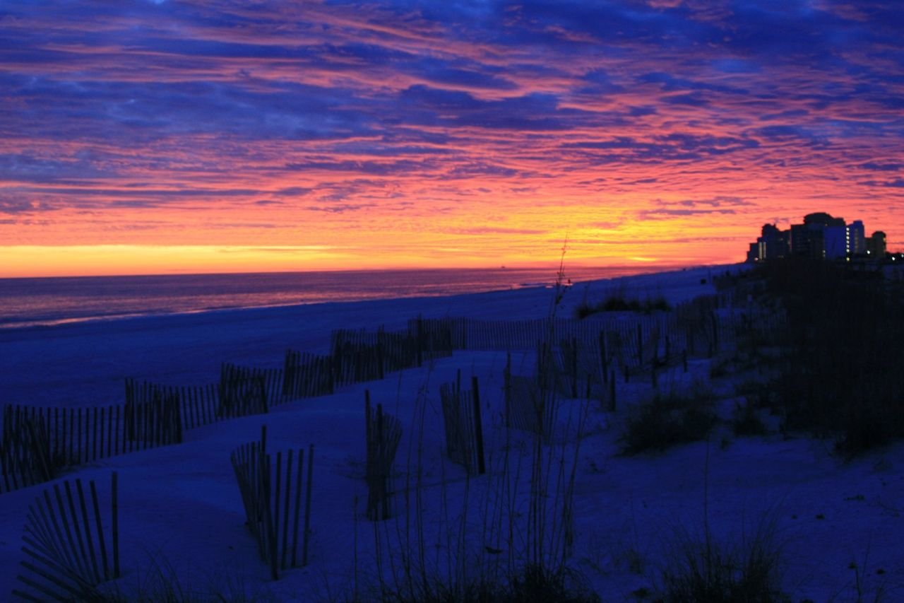 The colors of the sunset over Alabama’s beaches range from subtle to dramatic.