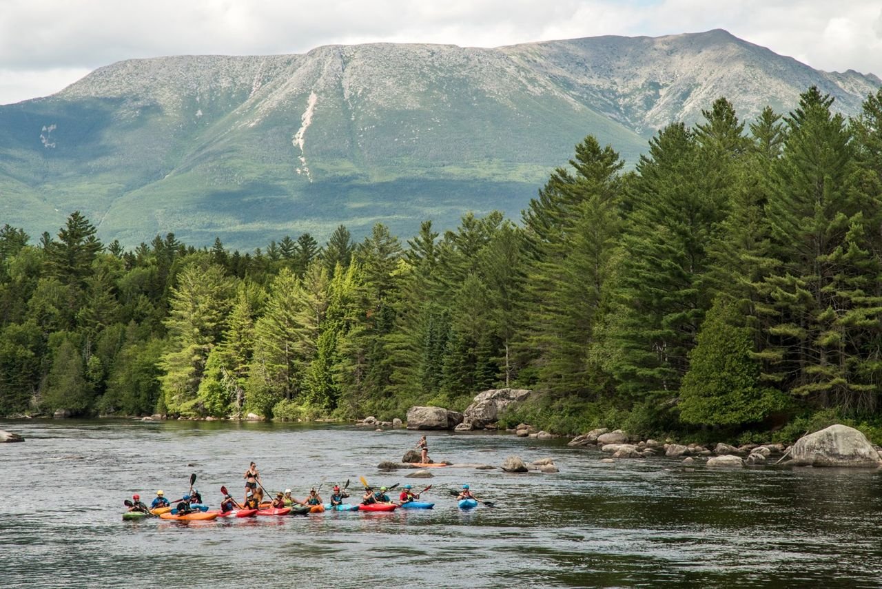 Kayakers and paddleboarders on the West Branch of the Penobscot River. Katahdin, Maine’s highest mountain, in background. Maine